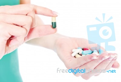 Capsules In Woman's Hand Stock Photo