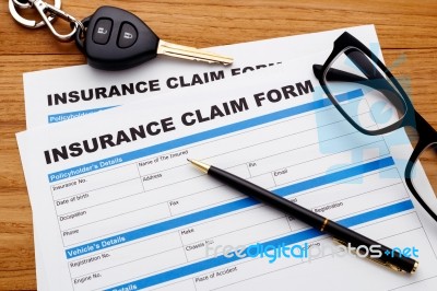 Car Insurance Claim Form With Pen Stock Photo