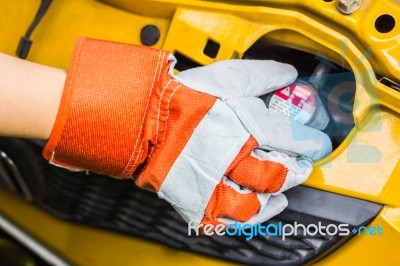 Car Mechanic In His Repair Shop Standing Next To The Car - Close… Stock Photo