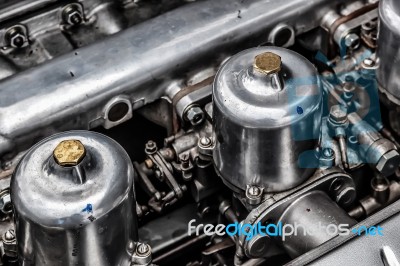 Carburettors Under The Bonnet Of An Old Jaguar Sports Car Stock Photo