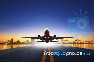 Cargo Plane Take Off From Airport Runways Against Ship Port Back… Stock Photo