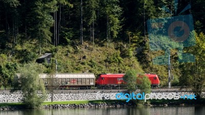 Cargo Train Running Along The Edge Of Lake Hallsattt Stock Photo