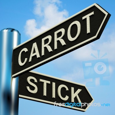 Carrot Or Stick Directions On A Signpost Stock Image