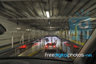 Cars Disembarking From The Ferry Stock Photo