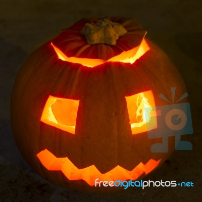 Carved Lit Halloween Pumpkin Stock Photo