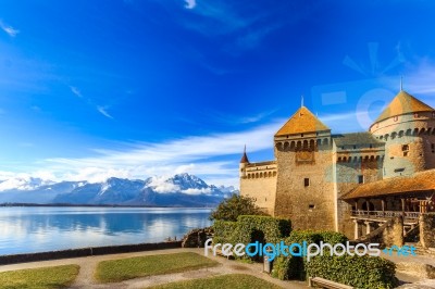 Castle By A Lake Front On A Blue Day Stock Photo