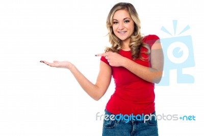 Casual Girl Presenting Something Stock Photo