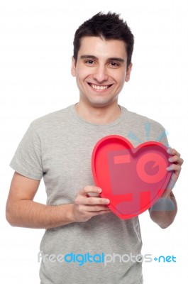 Casual Man Holding Heart Stock Photo