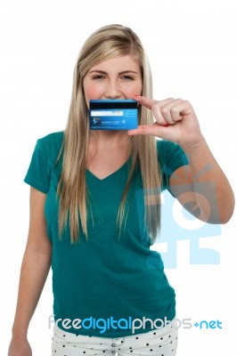 Casual Teenager Holding Up Credit Card Stock Photo