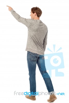 Caucasian Man Standing Pointing Stock Photo