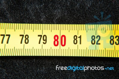 Centimeters Near A Tape Measure On The Number Eighty Stock Photo