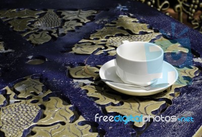 Ceramic Cup On Saucer With Metal Spoon Above Classic Teble Stock Photo