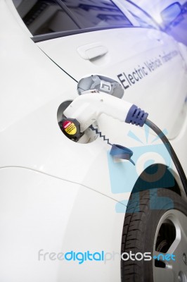 Charging An Electric Car Stock Photo