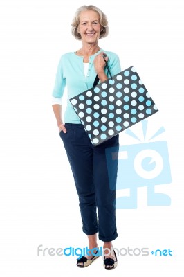 Charming Senior Lady With Shopping Bag Stock Photo