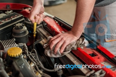 Checking For Engine Oil On A Car Stock Photo