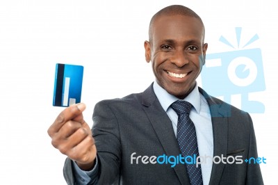 Cheerful Businessman Holding Credit Card Stock Photo