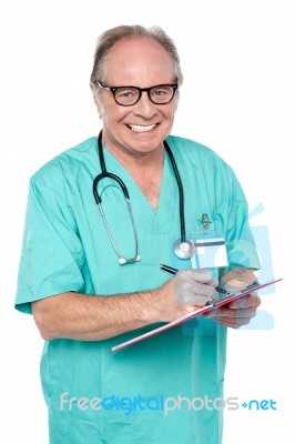 Cheerful Doctor Gathering Information From Patient Stock Photo