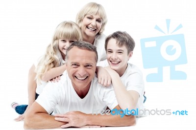 Cheerful Family Of Four Isolated On White Stock Photo