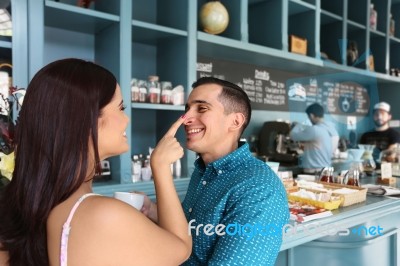 Cheerful Loving Couple Having Fun In Cafeteria Stock Photo