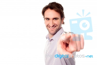 Cheerful Man Pointing Towards Camera Stock Photo