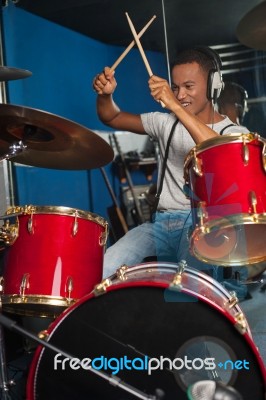 Cheerful Musician Playing Drums Stock Photo