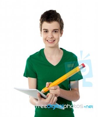 Cheerful Student Writing Notes Stock Photo