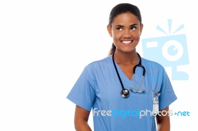 Cheerful Young Doctor Is Looking Away Stock Photo