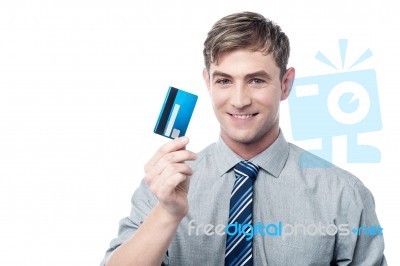 Cheerful Young Executive Holding Credit Card Stock Photo