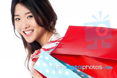 Cheerful Young Shopaholic Girl Stock Photo