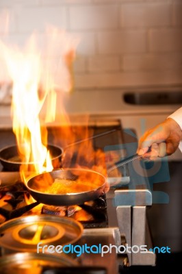 Chef Cooking In Kitchen Stove Stock Photo