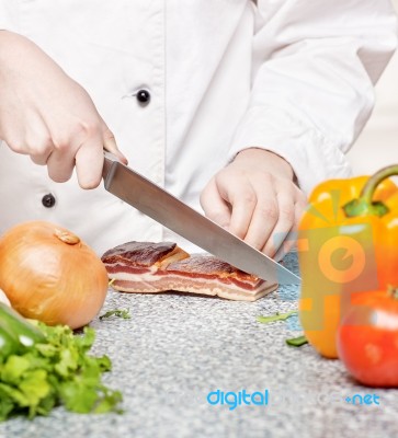 Chef Cutting Bacon Stock Photo