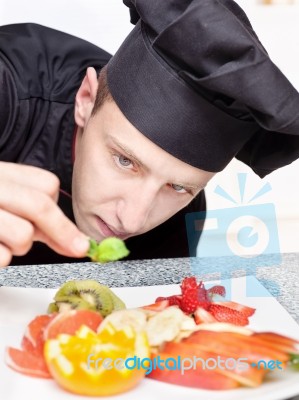 Chef Decorating Delicious Fruit Plate Stock Photo
