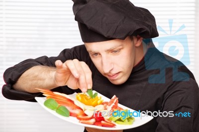 Chef Decorating Delicious Fruit Plate Stock Photo