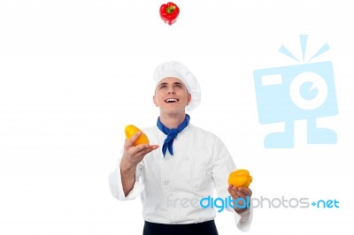 Chef Juggling With Vegetables Stock Photo