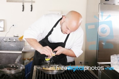 Chef Putting Grated Parmesan To An Italian Pasta Stock Photo