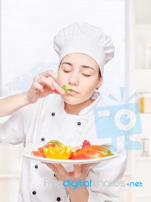 Chef Smell Mint And Hold Plate Of Fruit Stock Photo