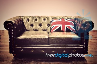Chesterfield Couch With Union Jack Cushion Stock Photo