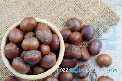 Chestnut On Wooden Stock Photo