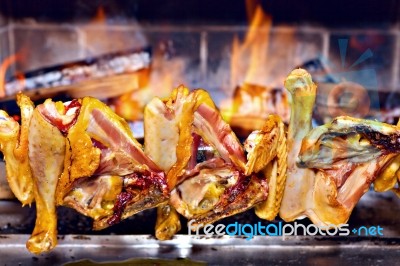 Chicken Roasting On Skewer Stock Photo
