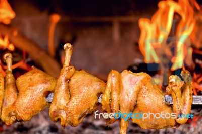 Chicken Roasting On Skewer Stock Photo