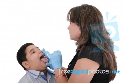 Child At The Physician Checking His Throat Stock Photo