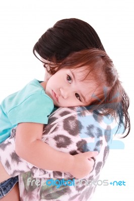 Child Hugging Her Mom Stock Photo