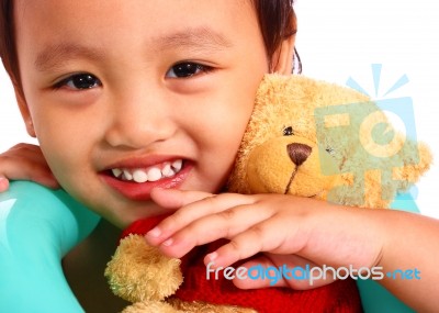 Child Hugging Toys Stock Photo