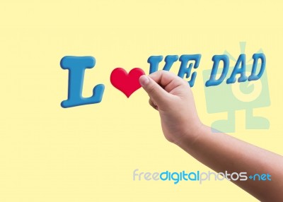 Child Or Kid’s Hand Hold Red Heard Form Filling To Blue Text L… Stock Image
