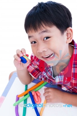 Child Show His Works From Clay, Over White. Strengthen The Imagi… Stock Photo