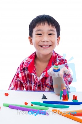 Child Smiling And Show His Works From Clay, On White Background Stock Photo
