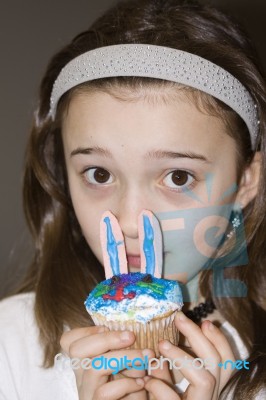 Child With Easter Bunny Cupcake Stock Photo