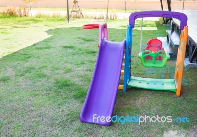 Children Playground On Lawn Park Stock Photo