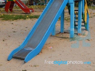 Children Playground, Swing Near The House  Stock Photo