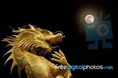 Chinese Dragon And Full Moon Stock Photo